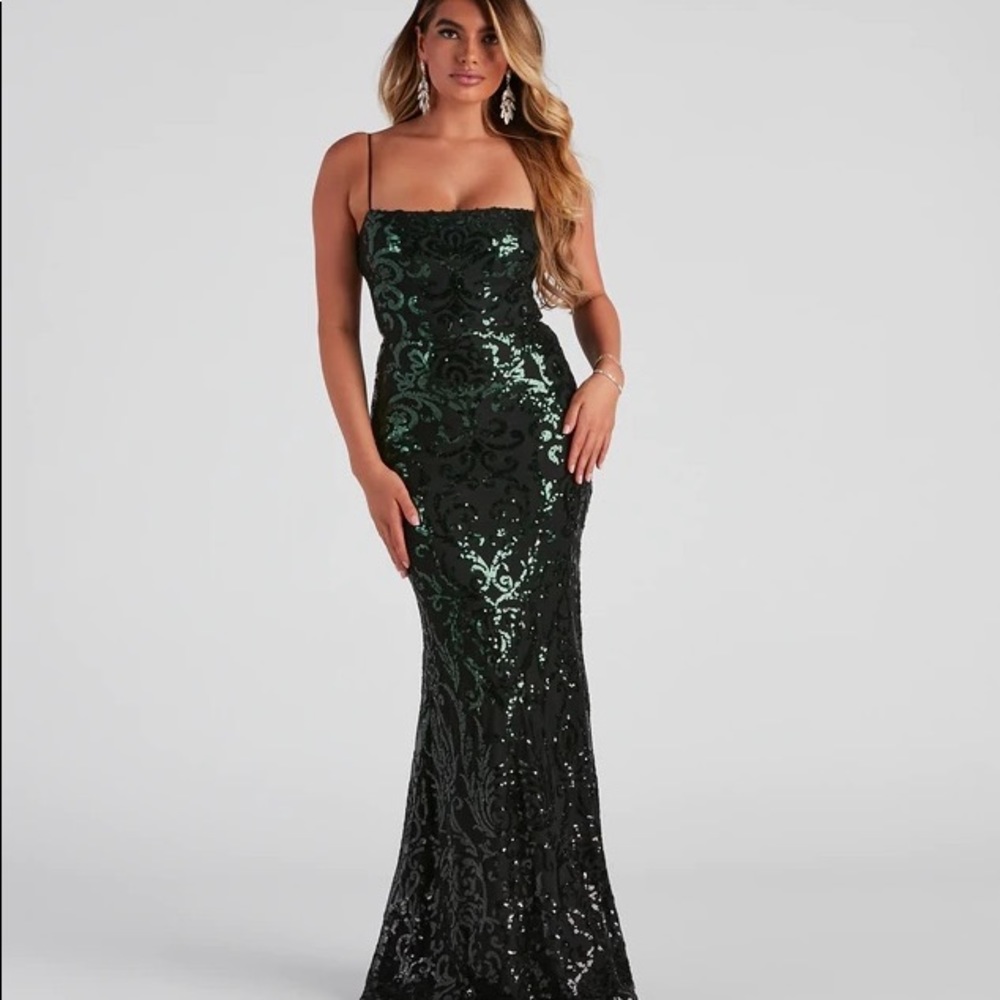 beautiful black dress with sequence and black cross stitching on the back